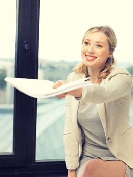 indoor picture of happy woman with documents