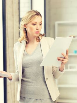 indoor picture of calm woman with documents