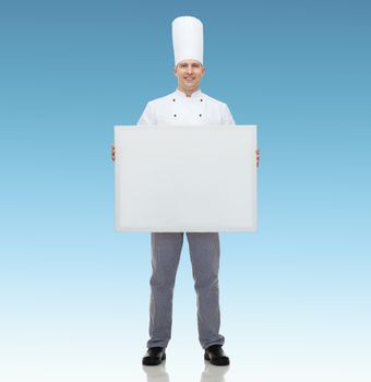 cooking, profession, advertisement and people concept - happy male chef cook holding and showing white blank big board over blue background