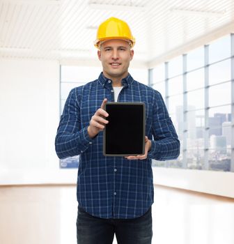 repair, construction, building, people and maintenance concept - smiling male builder or manual worker in helmet showing tablet pc computer blank screen over empty flat background