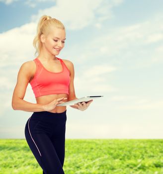 sport, exercise, technology, internet and healthcare concept - smiling sporty woman with tablet pc computer