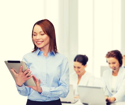 business, internet and technology concept - smiling woman looking at tablet pc computer at office