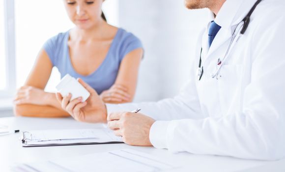 close up of patient and doctor prescribing medication