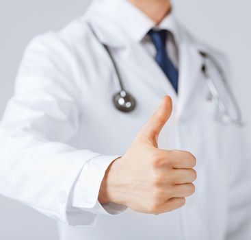 close up of male doctor hand showing thumbs up