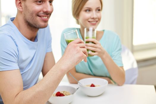 food, eating, people and healthy food concept - close up of couple having breakfast at home
