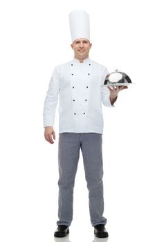 cooking, profession and people concept - happy male chef cook holding cloche