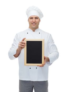 cooking, profession, advertisement and people concept - happy male chef cook showing and holding blank menu board