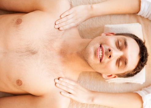 close up of man face in spa salon getting massage