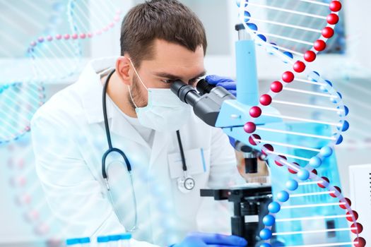 science, medicine, technology, biology and people concept - young male scientist looking to sample through microscope and making test or research in clinical laboratory over dna molecule structure