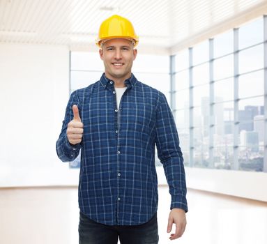 repair, construction, building, people and maintenance concept - smiling male builder or manual worker in helmet showing thumbs up