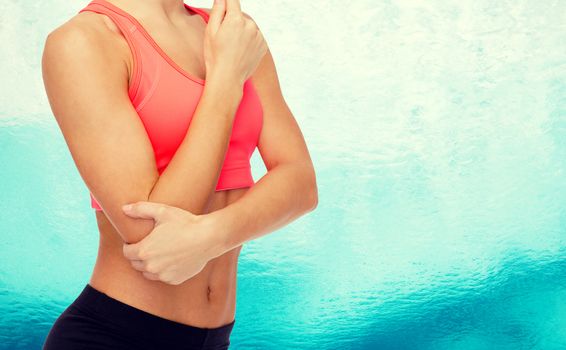 healthcare, fitness and medicine - sporty woman with pain in elbow