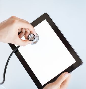 close up of male doctor with stethoscope and tablet pc