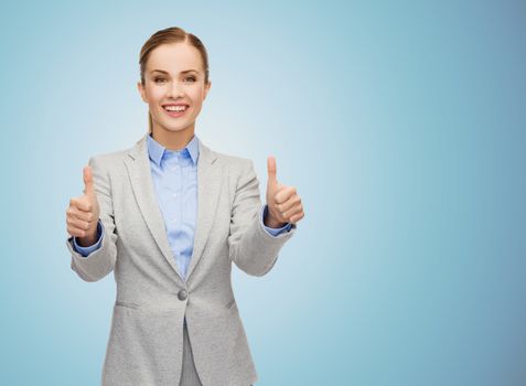 business, education, gesture and people concept - smiling businesswoman showing thumbs up over blue background