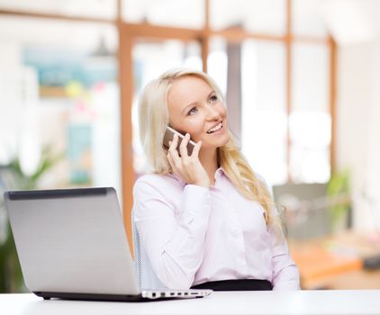 education, business, communication and technology concept - smiling businesswoman or student with laptop computer calling on smartphone over office room background