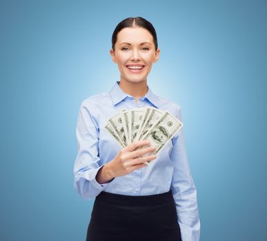 business and money concept - young businesswoman with dollar cash money over blue background