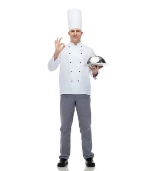 cooking, profession, gesture and people concept - happy male chef cook holding cloche and showing ok sign