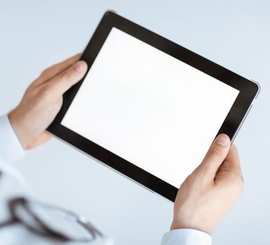close up of male doctor hands holding tablet pc