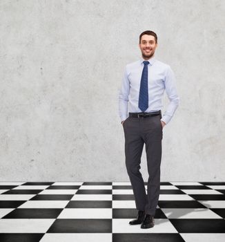 business, people and strategy concept - happy smiling businessman in shirt and tie on checkerboard pattern floor over gray background
