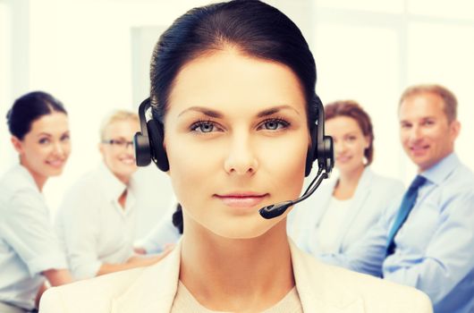 business and technology concept - helpline operator with headphones in call centre