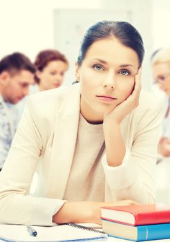 business and education concept - stressed businesswoman in office