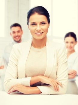 business concept - attractive young businesswoman in office