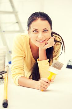 bright picture of lovely housewife painting at home