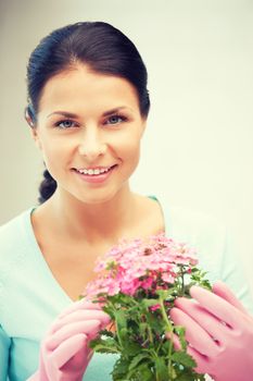 bright picture of lovely housewife with flower.