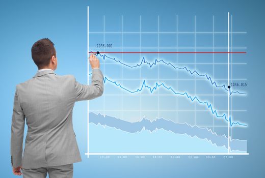 business, people, statistics and economical crisis concept - businessman drawing virtual chart from back over blue background