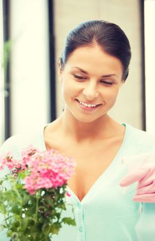 bright picture of lovely housewife with flower