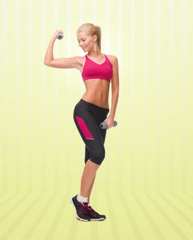 sport, fitness, training, weightlifting and people concept - young sporty woman with dumbbells flexing biceps over yellow striped background