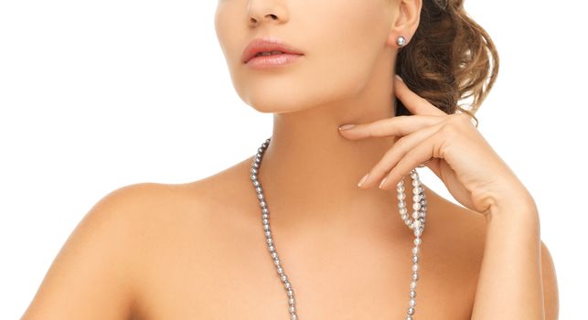 bride and wedding concept - beautiful woman wearing pearl earrings and necklace