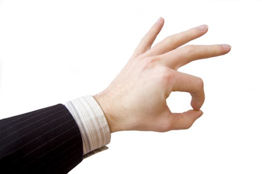 Success in business. Businessman hand shows the sign of victory.