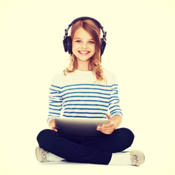 music, technology and shopping concept - child with headphones and tablet pc