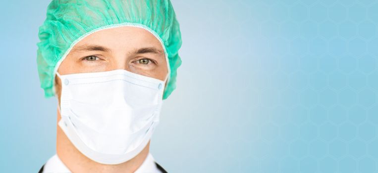 people, medicine and health care concept - male surgeon face in medical cap and mask over blue background