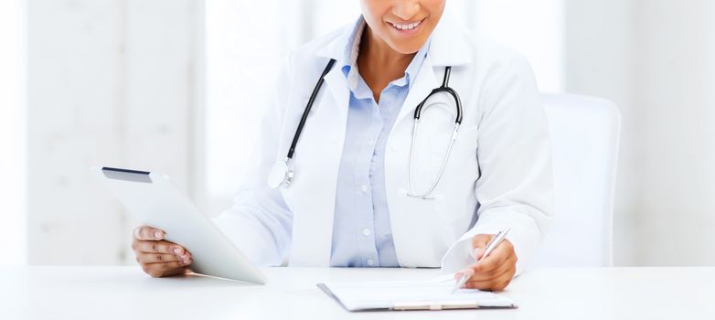 healthcare, medical and technology concept - african female doctor with tablet pc writing prescription