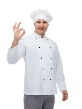 cooking, profession, gesture and people concept - happy male chef cook showing ok sign