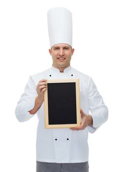 cooking, profession, advertisement and people concept - happy male chef cook showing and holding blank menu board