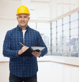 repair, construction, building, people and maintenance concept - smiling male builder or manual worker in helmet with clipboard taking notes over empty flat background
