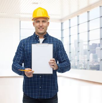 repair, construction, building, people and maintenance concept - smiling male builder or manual worker in helmet showing blank paper on clipboard over empty flat background