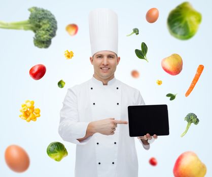 cooking, profession, technology, vegetarian diet and people concept - happy male chef cook showing tablet pc computer black blank screen