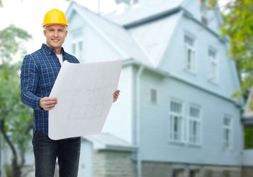 repair, construction, building, people and maintenance concept - smiling male builder or manual worker in helmet with blueprint over living house background