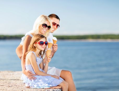 summer holidays, celebration, children and people concept - happy family eating ice cream