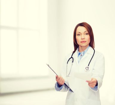 healthcare and medicine concept - calm female doctor with clipboard and stethoscope