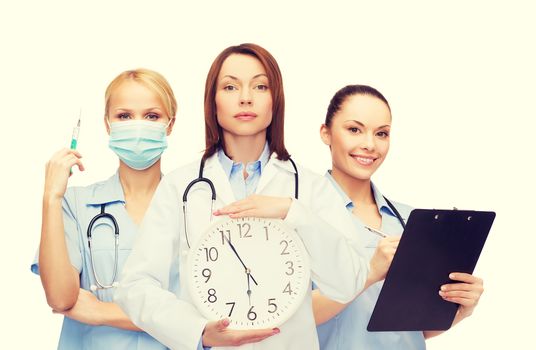 healthcare and medicine concept - calm female doctor and nurses with wall clock and stethoscope