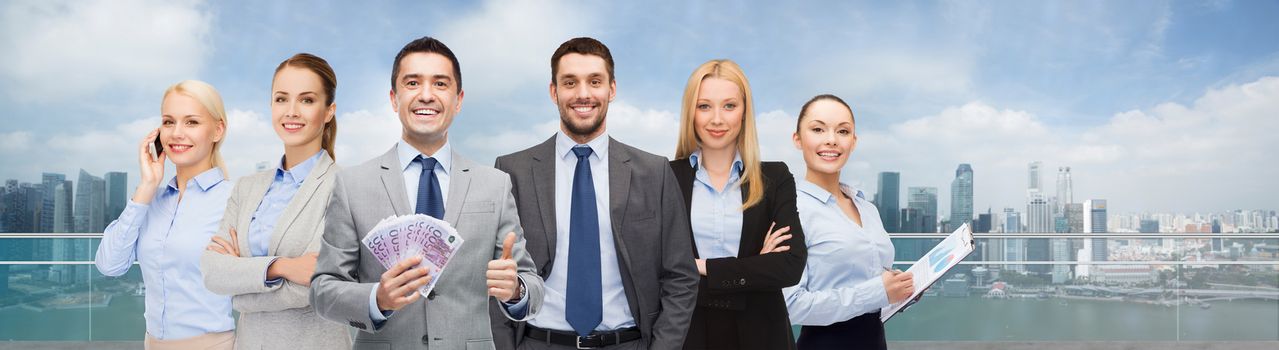 business, people and finances concept - group of smiling businessman with american dollar money