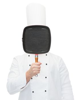 cooking, profession and people concept - male chef cook covering face or hiding behind grill pan