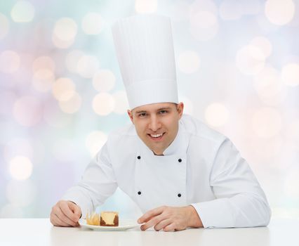 cooking, profession, haute cuisine, food and people concept - happy male chef cook with dessert over blue lights background