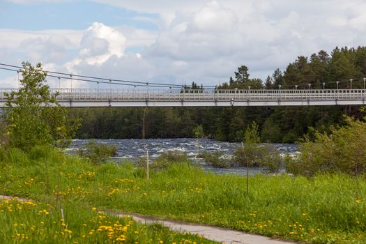 Suspension bridge over the River Niva Kandalaksha city. Russia