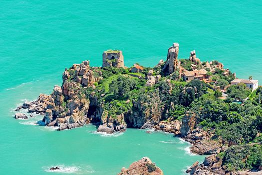 Small island in Italy with houses and ruins