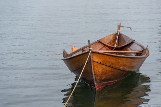 Old wooden row boat moored